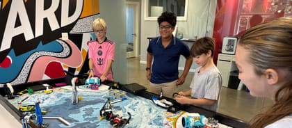 Students working together on a robot build at UP Robotics