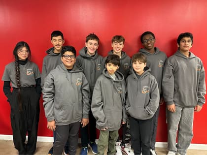 An UP Robotics FIRST Tech Challenge team with its competition robot