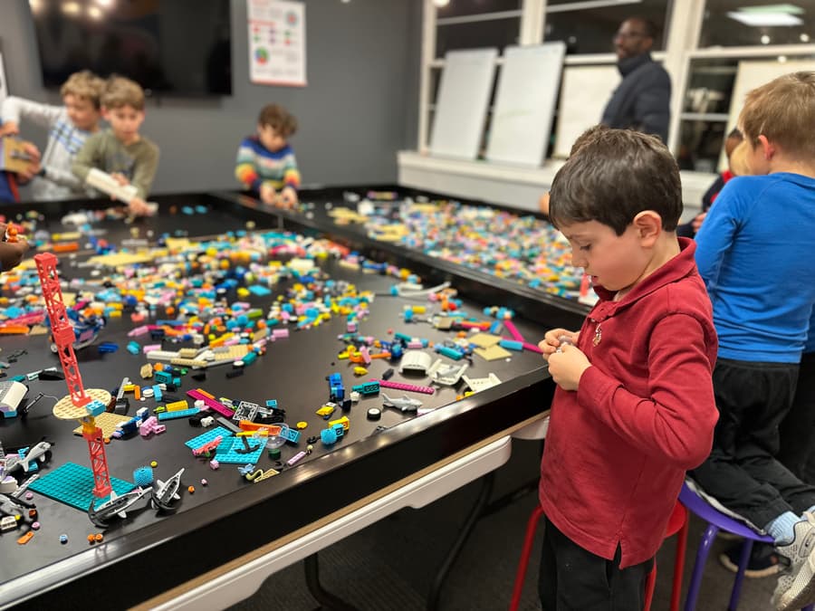 Kids celebrating a birthday around the robotics table